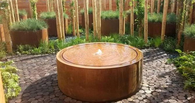 фонтан поверхности грунтовых вод Corten ржавчины сада Dia 120cm поверхностный цилиндрический стальной